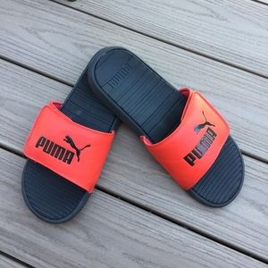 red and black puma slides